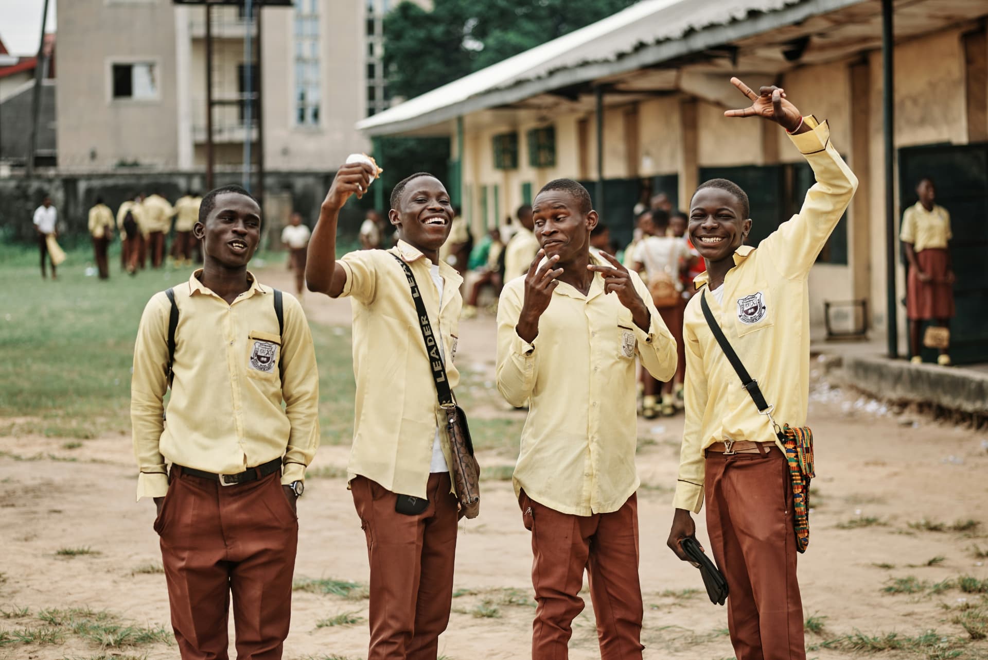 Cameroonian secondary school students standing together outside school
