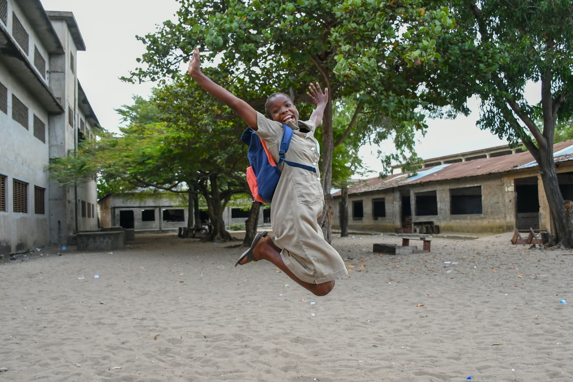 A confident Cameroonian student celebrating academic progress